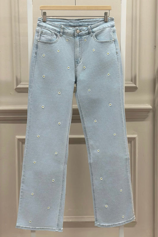 Blaue Jeans mit Gänseblümchen-Stickerei